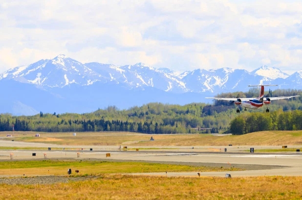 File photo of a Ravn Alaska plane landing on the Ted Stevens International Airport in Anchorage.