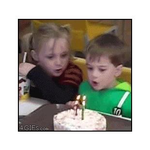 Girl-blows-out-brothers-birthday-candles