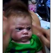 An angry baby is not amused.