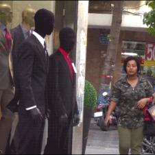 A man pretends to be a mannequin