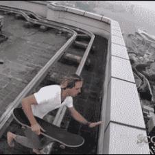 Skateboarding on high roof ledge