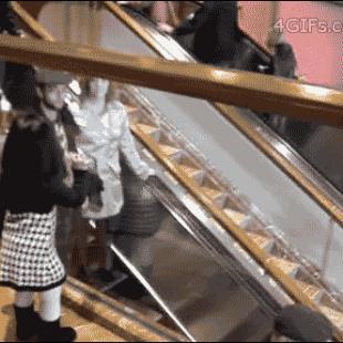 Escalator-girl-waves-goodbye