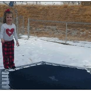 Kid-jumps-on-frozen-ice-trampoline