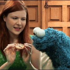 The Cookie Monster is teased with a cookie.