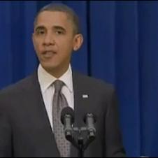 Obama kicks a door open after finishing a speech.